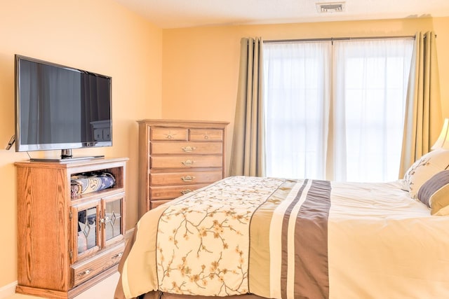 bedroom featuring visible vents