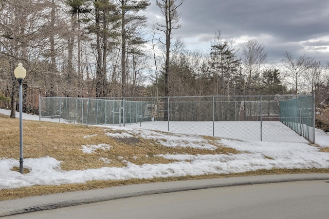 view of tennis court with fence