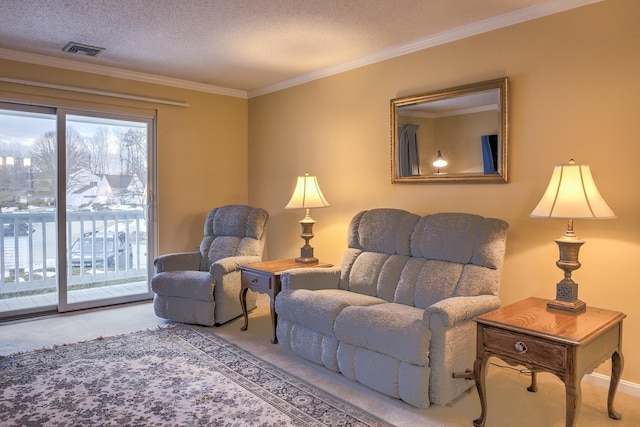 sitting room with carpet flooring, a textured ceiling, crown molding, and visible vents