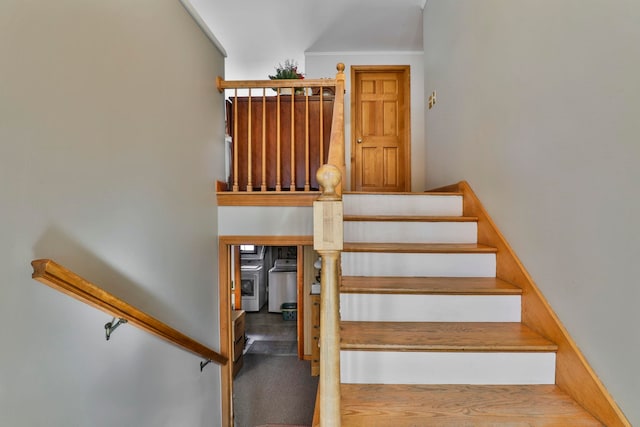 staircase featuring washer / clothes dryer