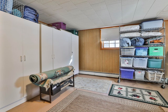 storage room featuring a baseboard heating unit