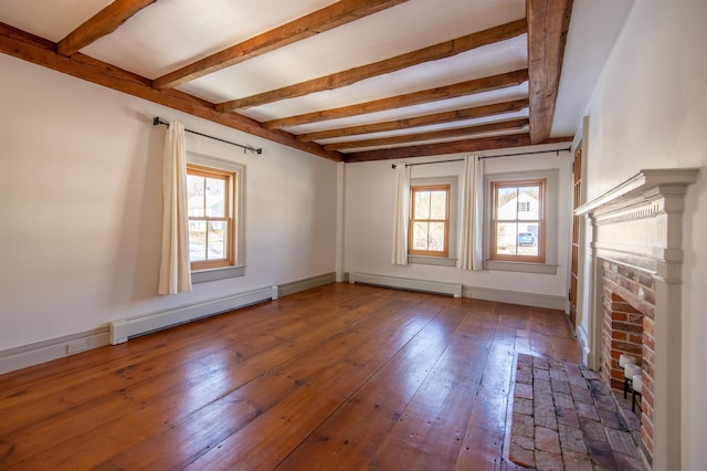 unfurnished living room featuring a brick fireplace, wood-type flooring, baseboard heating, and beam ceiling