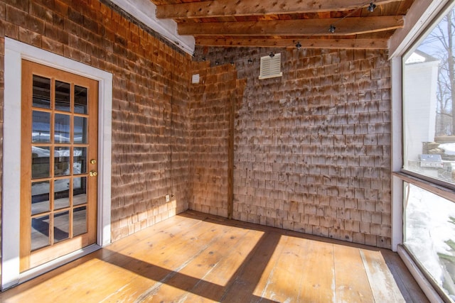 interior space featuring vaulted ceiling with beams