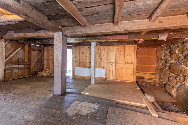 below grade area featuring hardwood / wood-style flooring