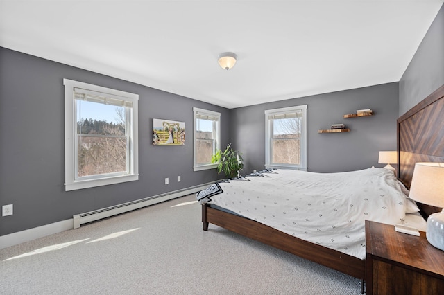 bedroom with baseboard heating and baseboards