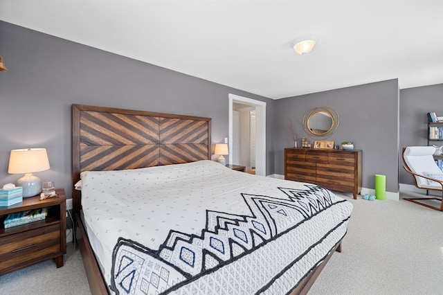 bedroom featuring baseboards and carpet floors