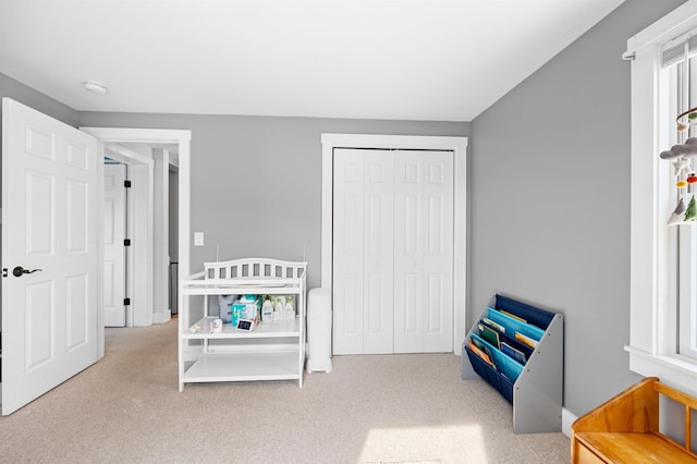 carpeted bedroom featuring a closet