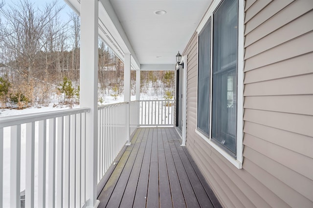 view of snow covered deck