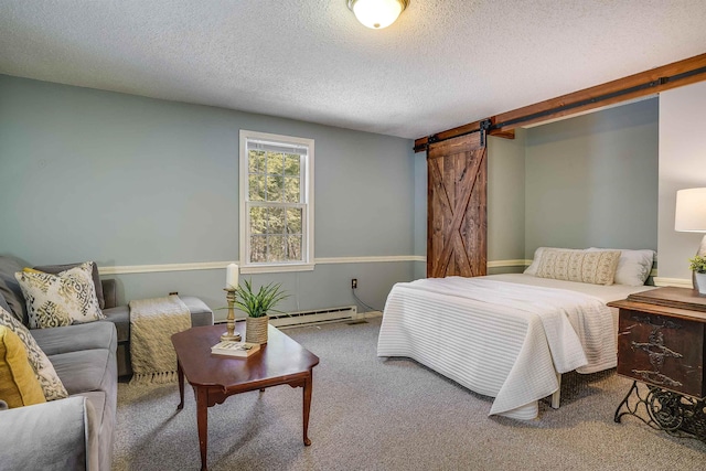 carpeted bedroom featuring a barn door, a textured ceiling, and baseboard heating