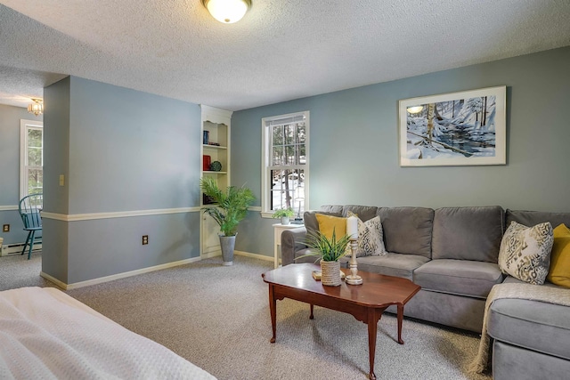 living area with carpet, baseboards, baseboard heating, and a textured ceiling