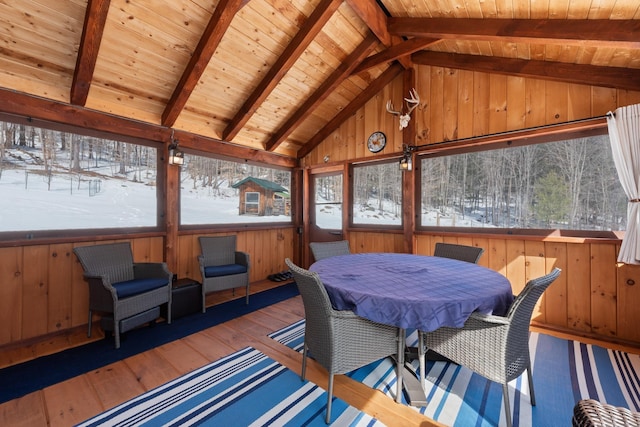 sunroom / solarium featuring wooden ceiling and vaulted ceiling with beams