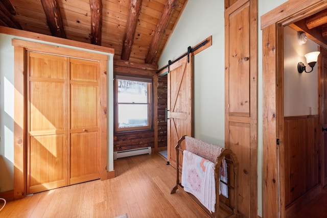 interior space with a baseboard radiator, lofted ceiling with beams, wood ceiling, light wood-style floors, and a barn door