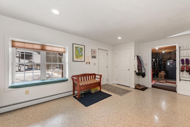 entrance foyer with baseboard heating, recessed lighting, and baseboards