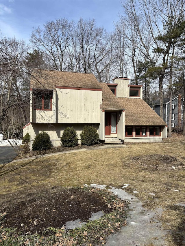 view of front of property with a shingled roof