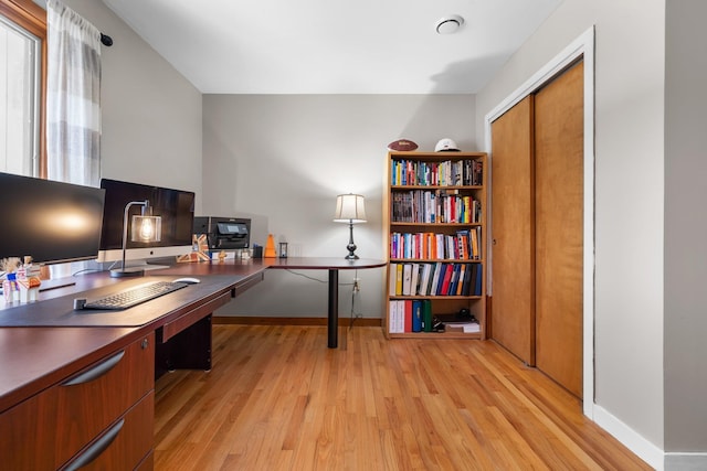 office featuring light wood finished floors and baseboards