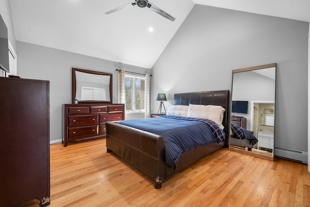 bedroom with ensuite bath, light wood-style flooring, high vaulted ceiling, and a baseboard radiator