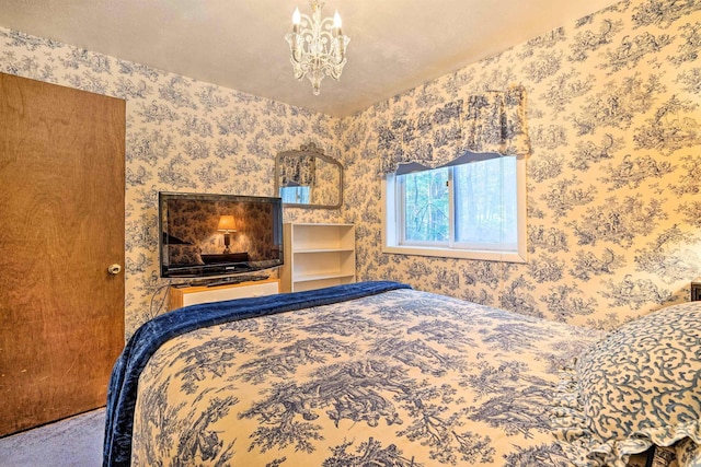 bedroom featuring a notable chandelier and wallpapered walls