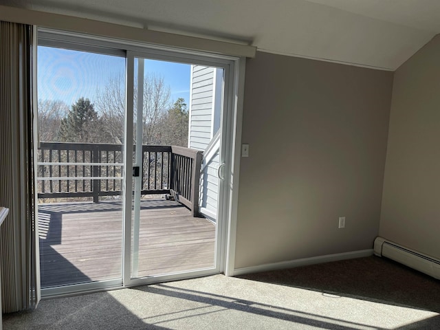 doorway featuring a baseboard heating unit, lofted ceiling, baseboards, and carpet floors