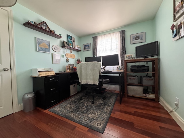 office area with baseboards and wood finished floors