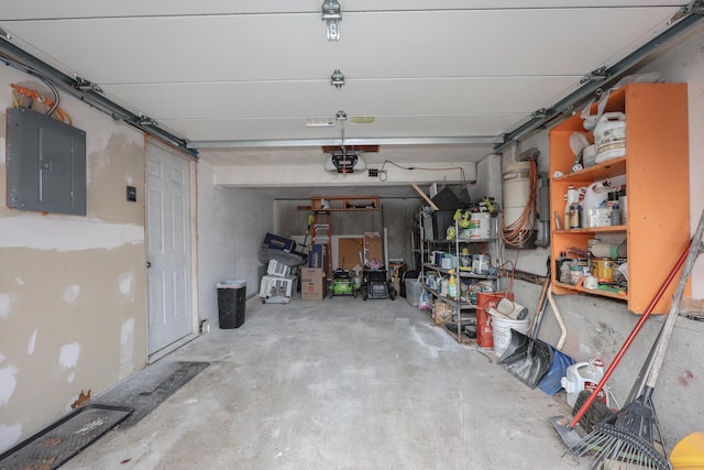 garage with electric panel and a garage door opener