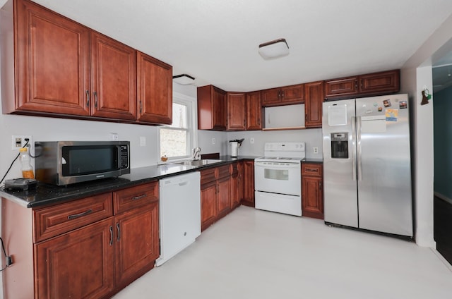 kitchen featuring appliances with stainless steel finishes and a sink