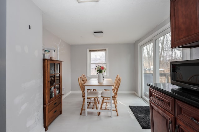 dining room featuring baseboards