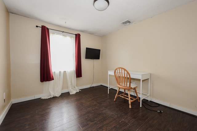 office with visible vents, baseboards, and wood finished floors