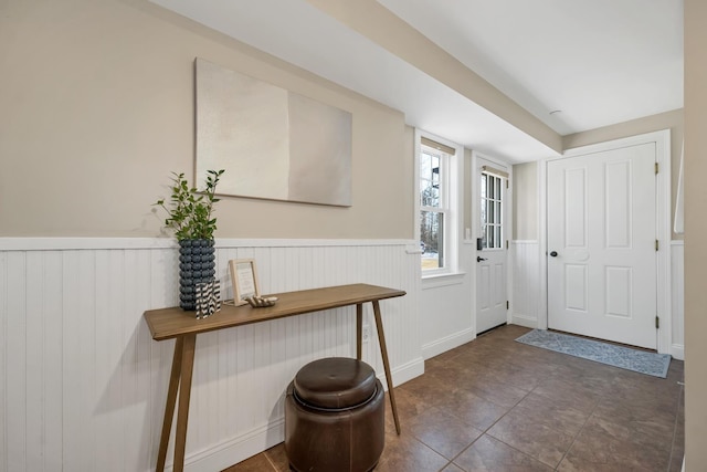 entryway featuring a wainscoted wall