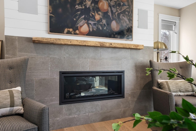 details with wood finished floors and a fireplace