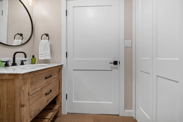 bathroom featuring vanity and wood finished floors