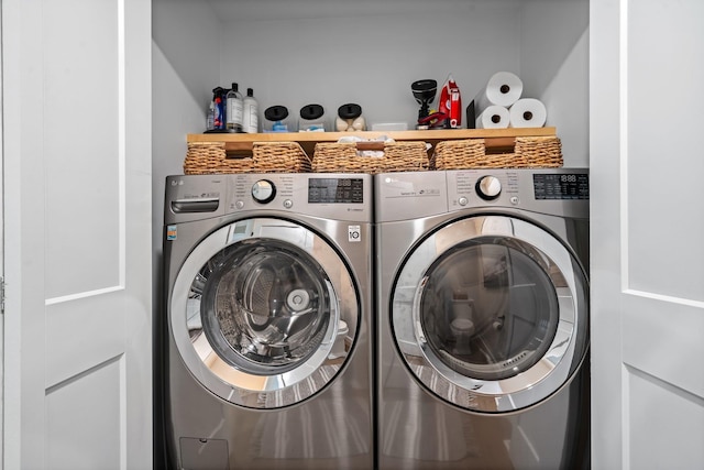 laundry area with washing machine and clothes dryer