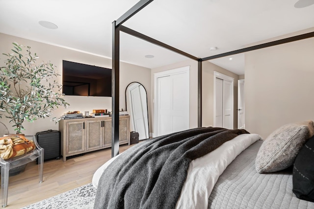 bedroom featuring light wood-style floors