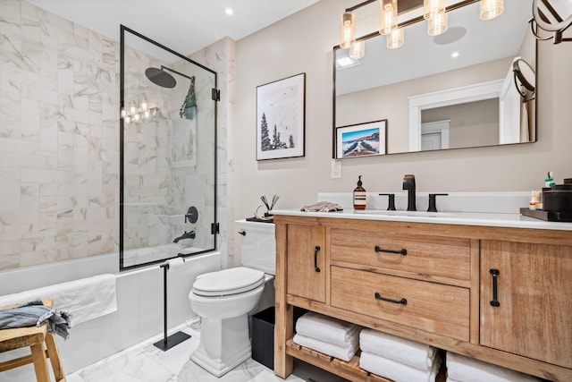 full bathroom featuring toilet, marble finish floor, recessed lighting, enclosed tub / shower combo, and vanity