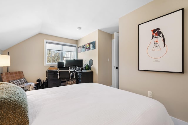 bedroom featuring lofted ceiling