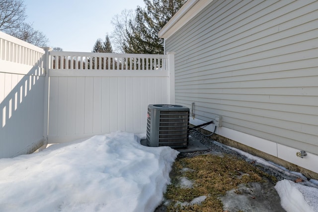 view of patio featuring cooling unit and fence