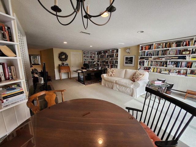 carpeted dining area featuring visible vents, a textured ceiling, and an inviting chandelier