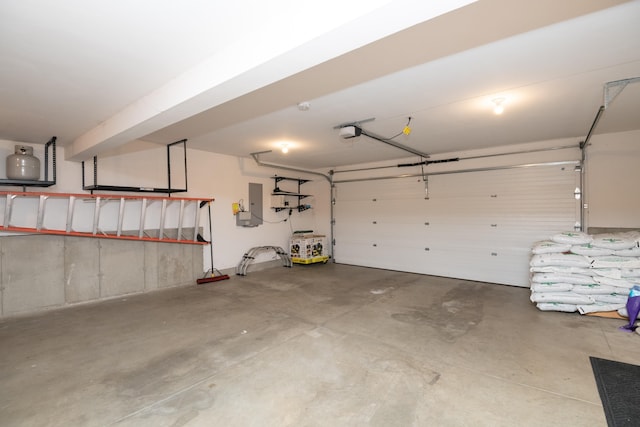 garage with electric panel and a garage door opener