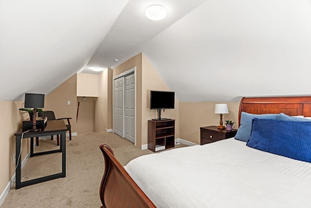 bedroom featuring light carpet, a closet, and baseboards