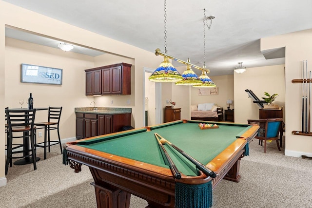 playroom with indoor wet bar, baseboards, light colored carpet, and pool table