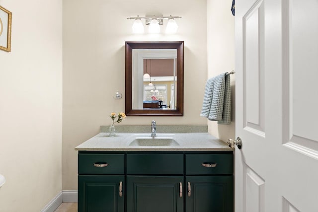 bathroom featuring vanity and baseboards