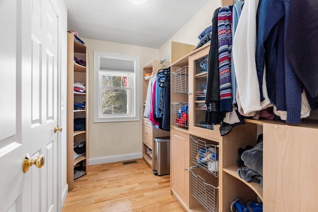 walk in closet featuring light wood-style flooring