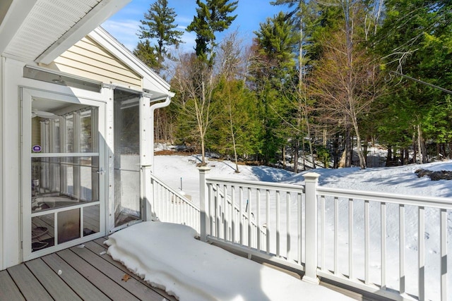 view of snow covered deck