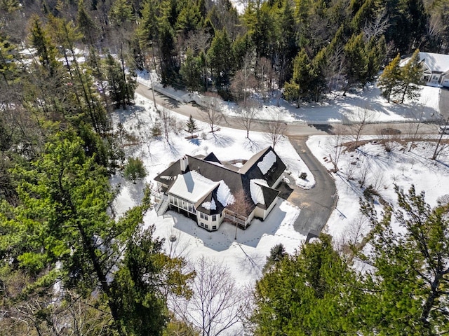 snowy aerial view with a view of trees