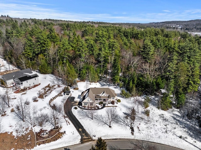 aerial view featuring a wooded view