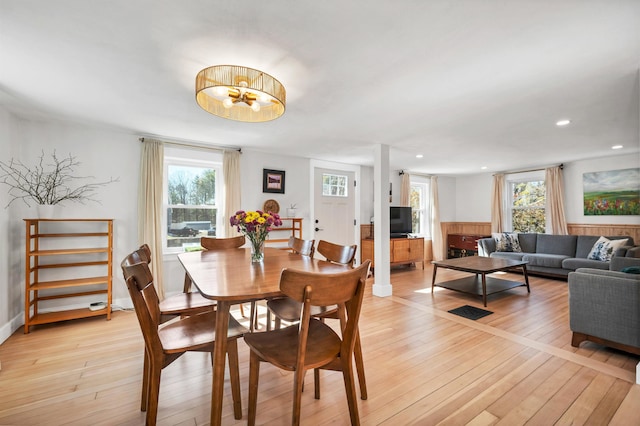 dining space with recessed lighting, plenty of natural light, and light wood-style flooring