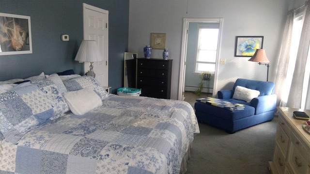 carpeted bedroom featuring a baseboard radiator