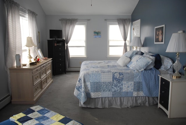 bedroom with vaulted ceiling, light colored carpet, and a baseboard radiator