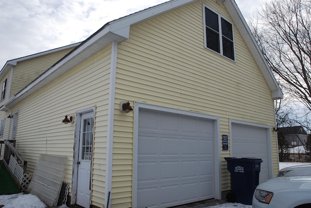 view of side of home featuring a garage