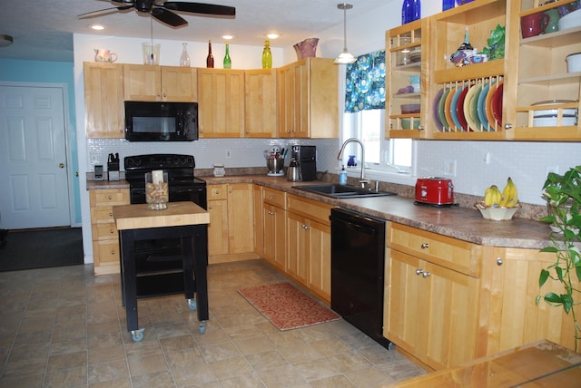 kitchen with a sink, decorative backsplash, black appliances, and light brown cabinetry