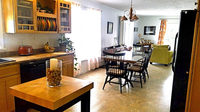 dining space with a textured ceiling